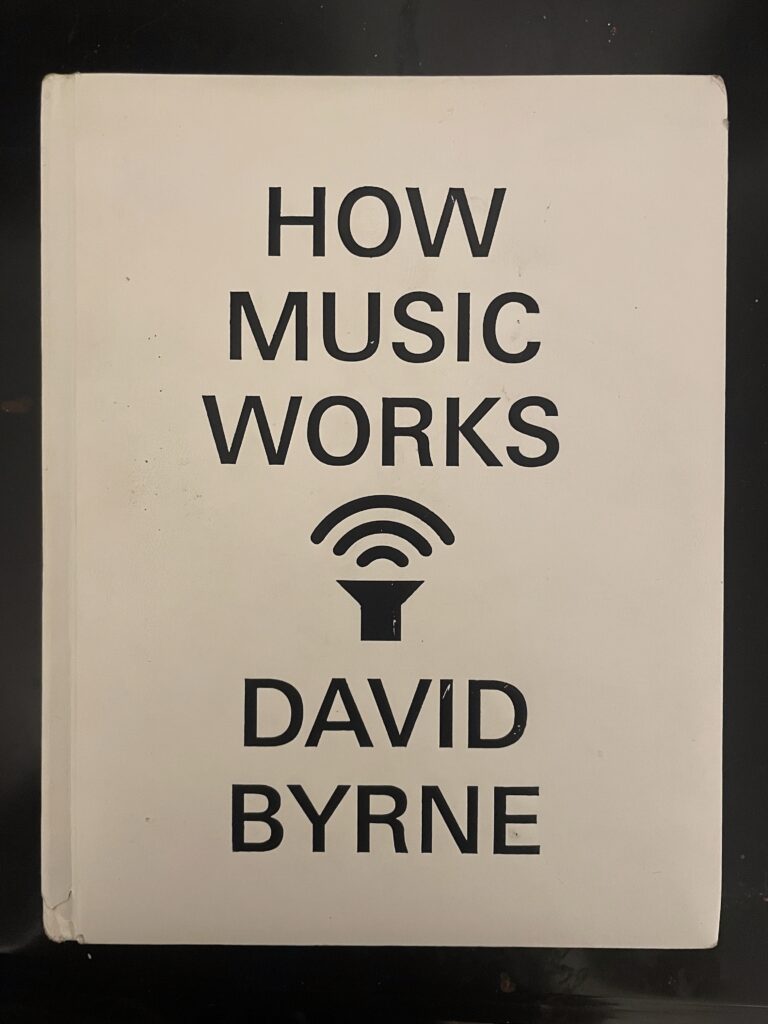 a book, How Music Works by David Byrne, against a black background