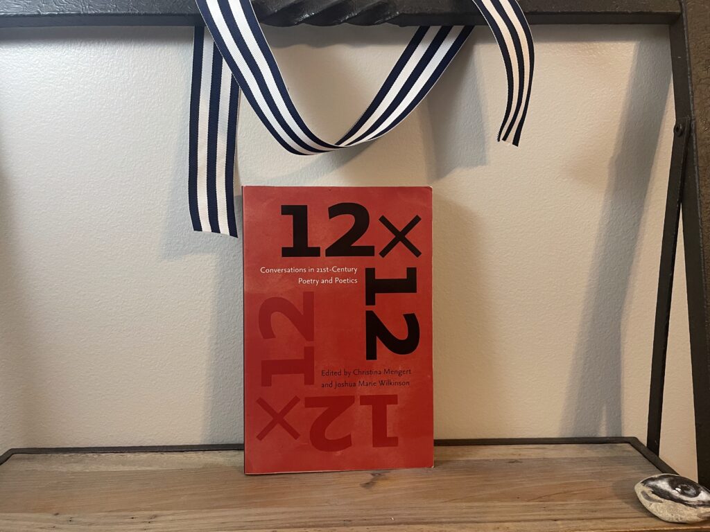 a book, 12x12 Conversations In 21st-Century Poetry and Poetics, on a shelf