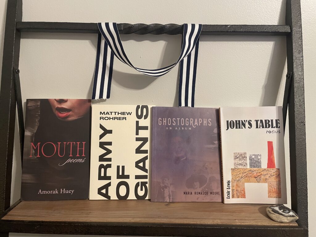 four books, Mouth by Amorak Huey, Army Of Giants by Matthew Rohrer, Ghostographs: An Album by Maria Romasco Moore, and John's Table by Lesle Lewis