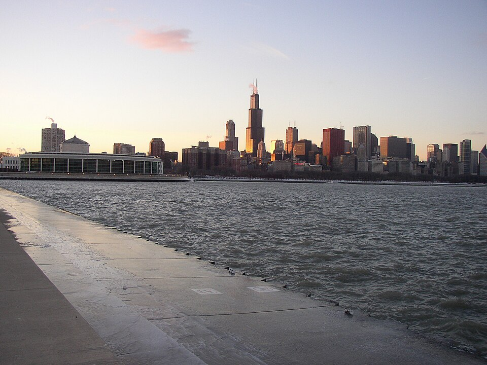 a view of the Alder Planetarium and the south side of the downtown Chicago skyline, from the concrete walkway by Lake Michigan