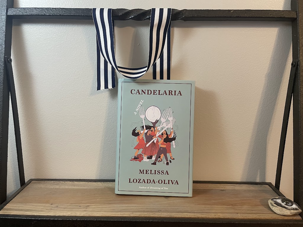 a book, CANDELARIA by Melissa Lozada-Oliva, on a shelf