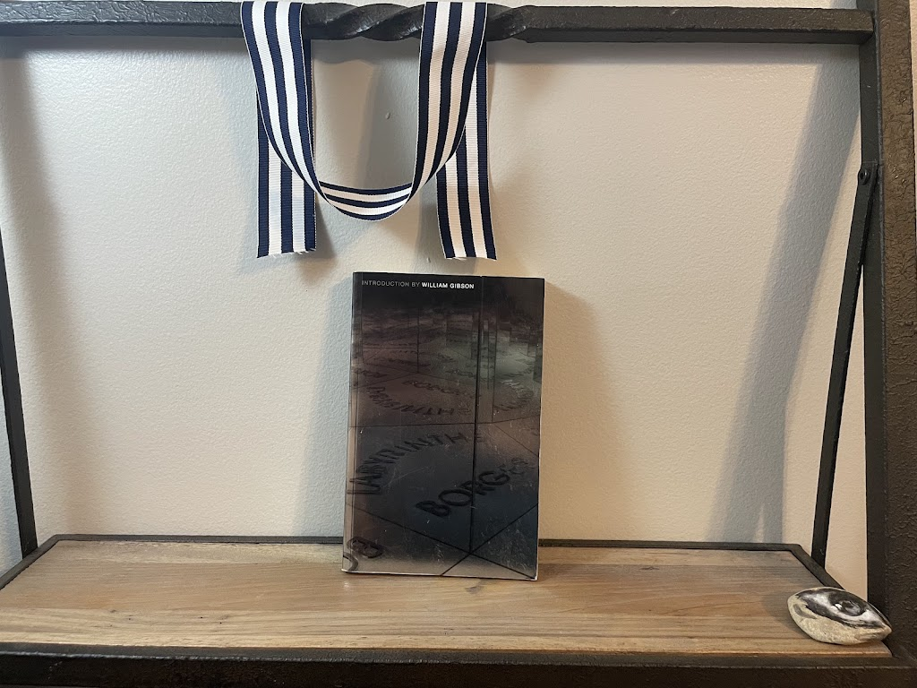 a book, LABYRINTHS by Jose Luis Borges, on a shelf