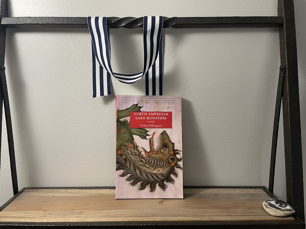 a book, NORTH AMERICAN LAKE MONSTERS by Nathan Ballingrud, on a shelf