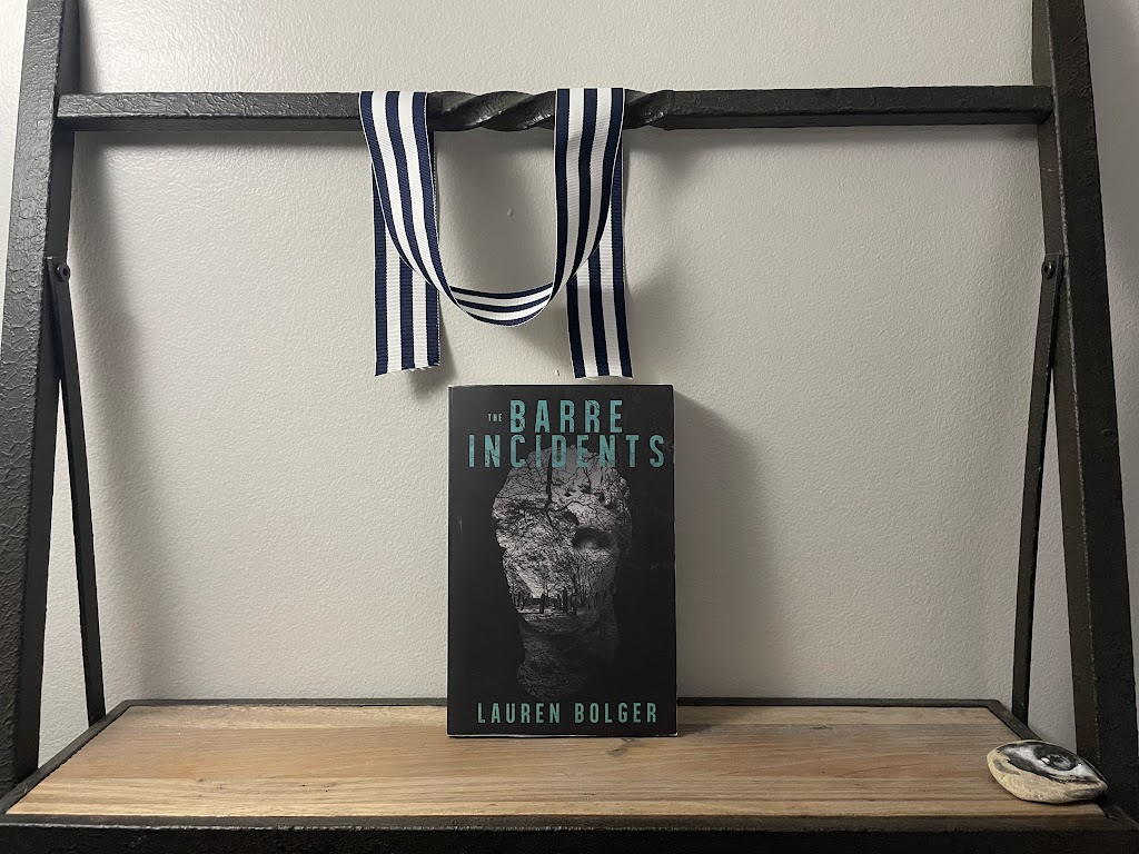 a book, THE BARRE INCIDENTS by Lauren Bolger, on a shelf