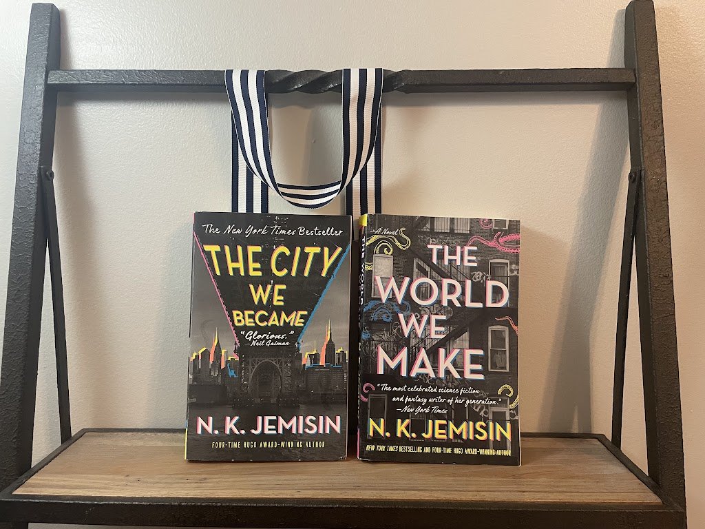 two books, THE CITY WE BECAME and THE WORLD WE MAKE by N.K. Jemisin, on a shelf