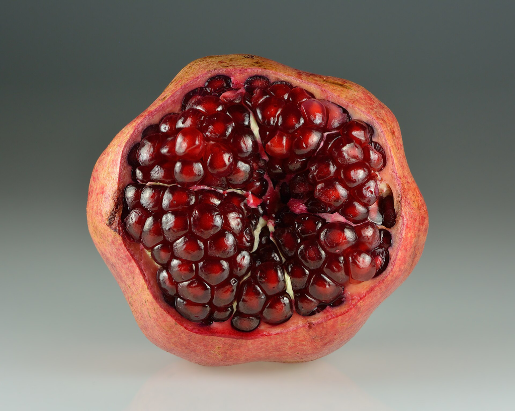 close up of a sliced open pomegranate