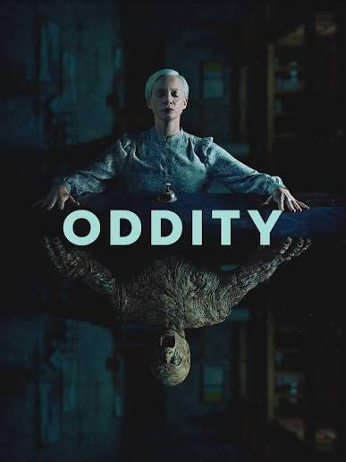 a blonde woman with her hands on a table and reflected in the table is a snarling wooden golem
